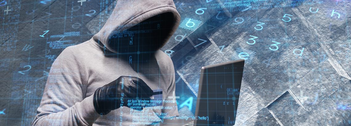 hacker using laptop to steal identity